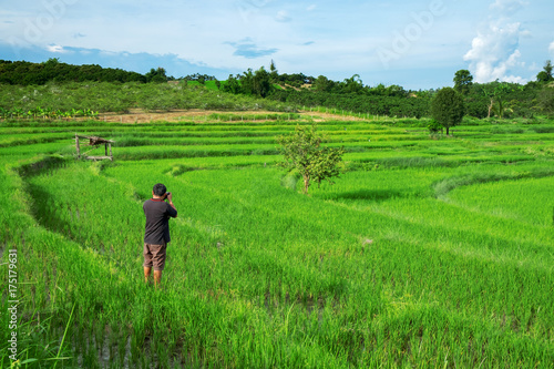 Urban Male Photographer taking a photo of lanscape rice terrace. © thaiprayboy