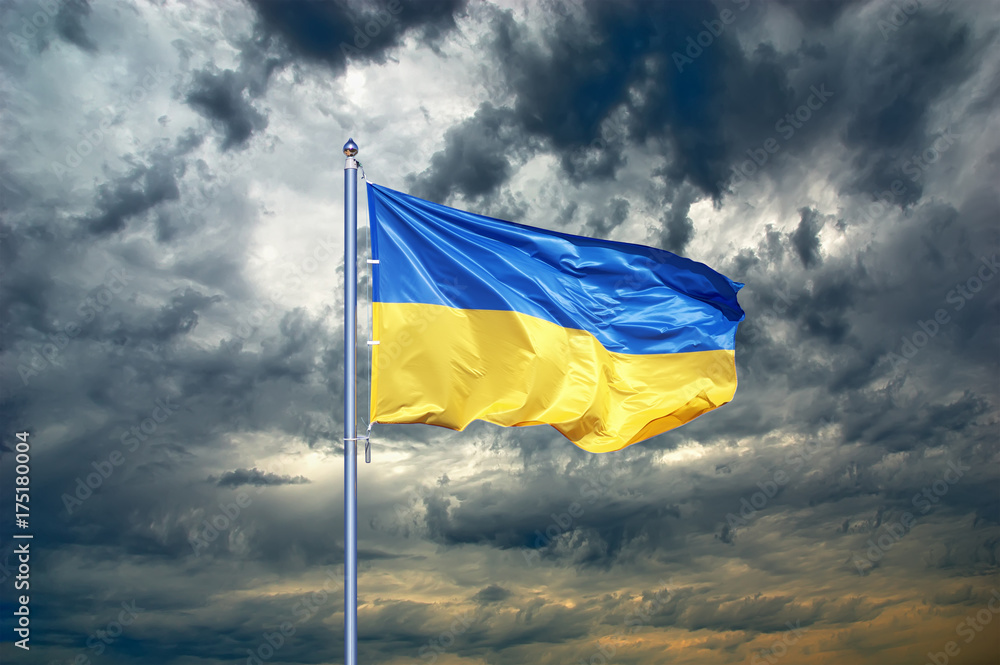 Obraz premium Ukraine flag. Ukrainian flag on black storm cloud sky. stormy weather