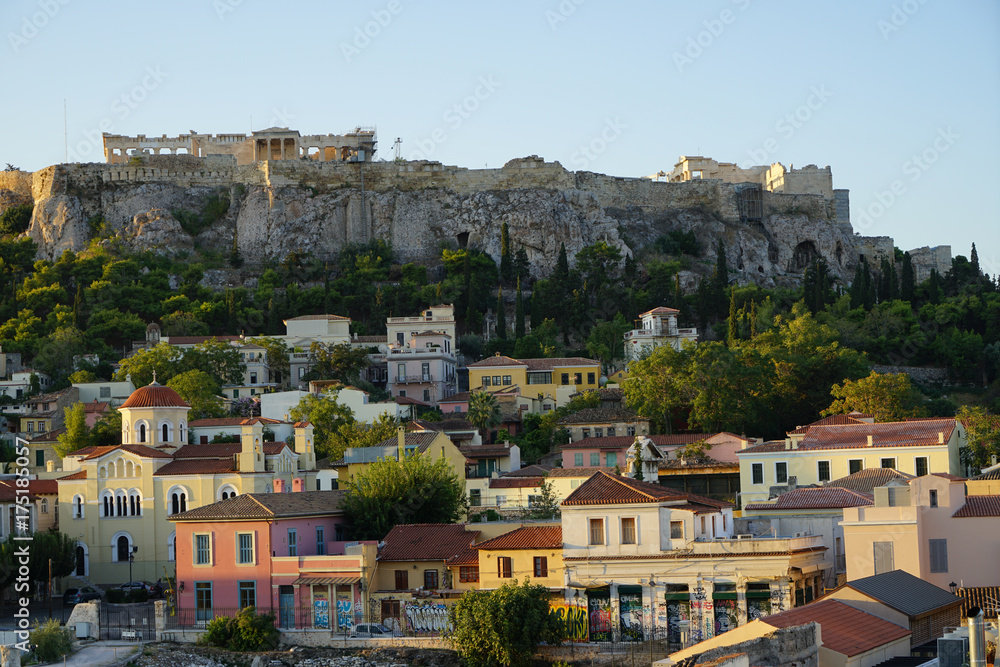 View of the ancient Acropolis, Erechtheion, from Monasteraki Square through old town neighborhood buildings