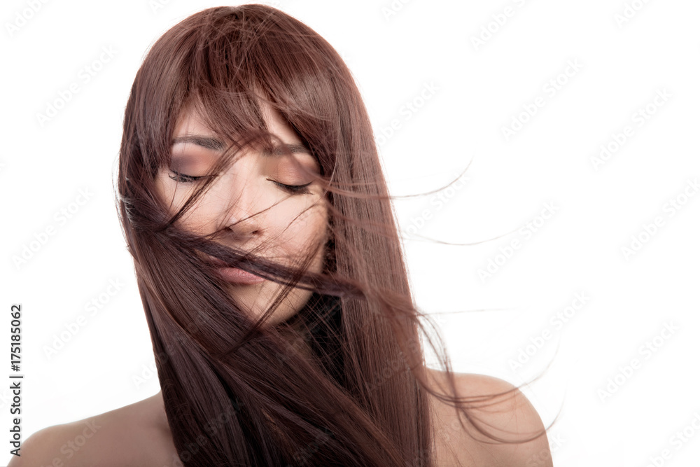 Brunette lovely girl. Healthy long hair flying over face