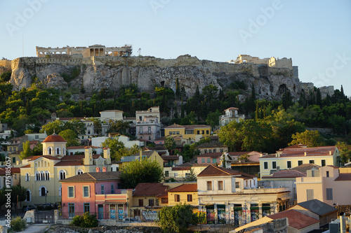 Fototapeta Naklejka Na Ścianę i Meble -  View of the ancient Acropolis, Erechtheion, from Monasteraki Square through old town neighborhood buildings