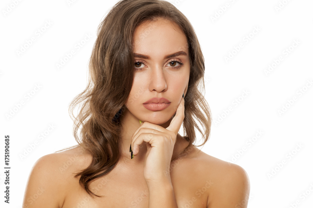 Thoughtful young beautiful woman posing on white background Thoughtful young beautiful woman posing on white background