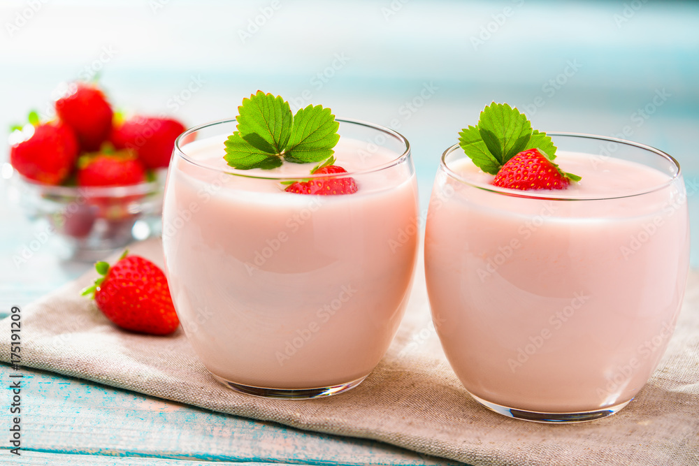 Two bowl of strawberry yogurt on wooden background Two bowl of strawberry yogurt on wooden background