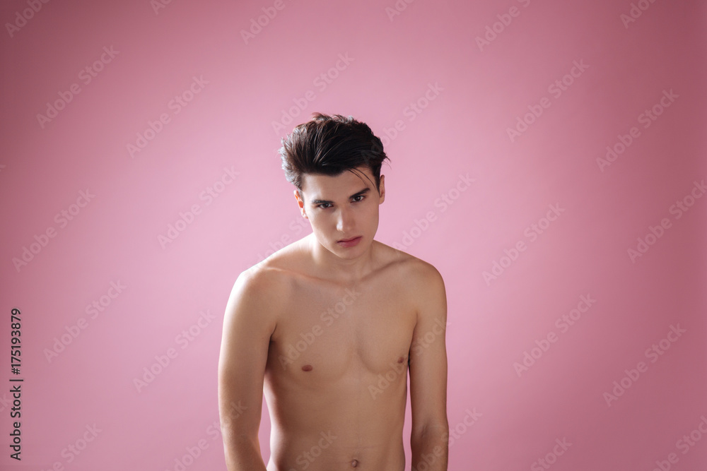 Fototapeta premium Sporty model standing isolated on pink