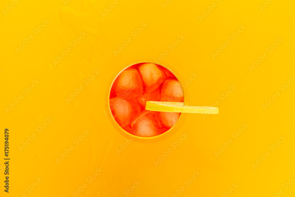 a cocktail glass from above with ice and lemon a cocktail glass from above with ice and lemon