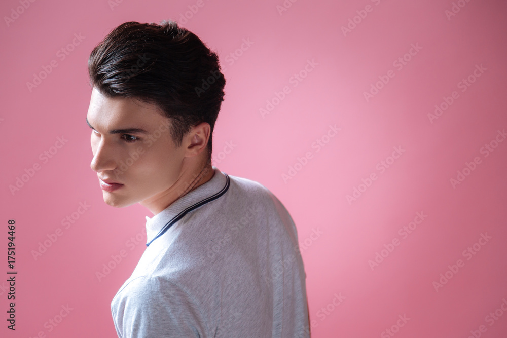 Concentrated young man looking forward Concentrated young man looking forward