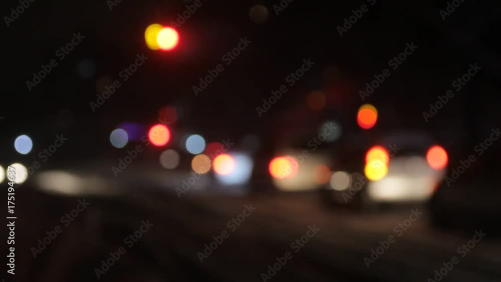movement of city transport in the evening during snowfall movement of city transport in the evening during snowfall