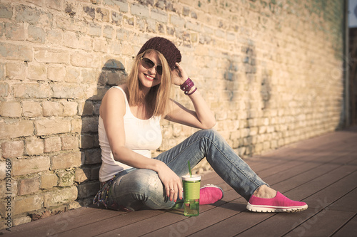 Happy hipster chilling outside