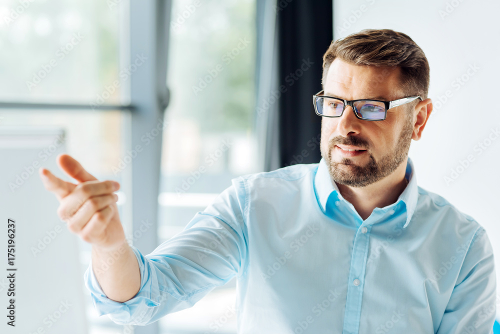 Serious office worker being in light room Serious office worker being in light room
