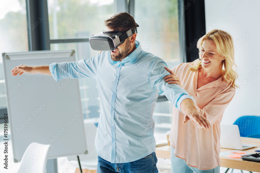 Fototapeta premium Relaxed man raising both arms