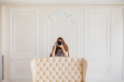 Woman photographer taking a shoot in a studio