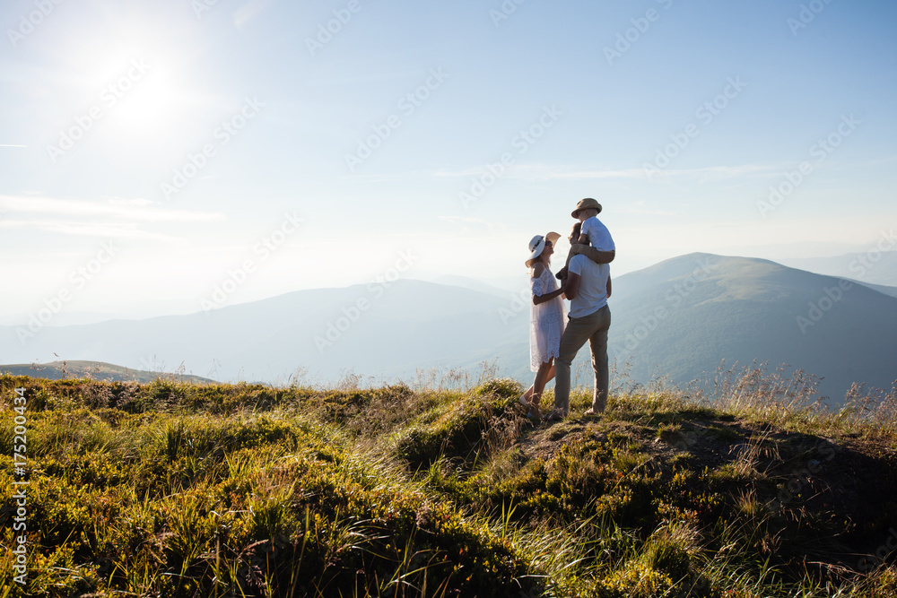 The family admires the mountain landscape The family admires the mountain landscape