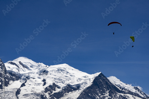 Paragliding over Mont Blanc massif in the French Alps above Chamonix.
