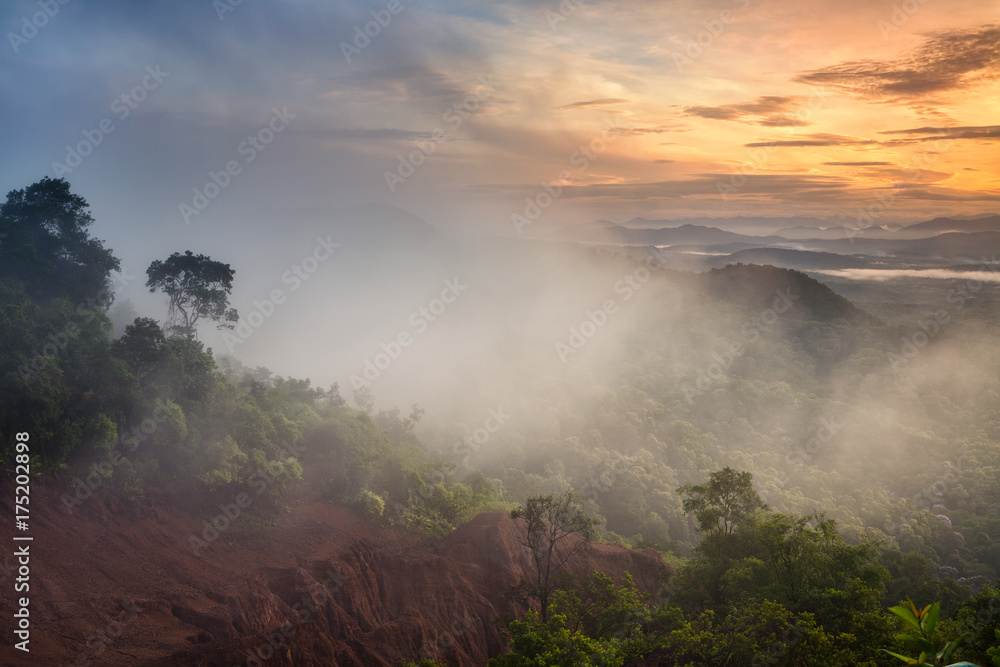 mountains under mist in the morning in Phrae province, Thailand