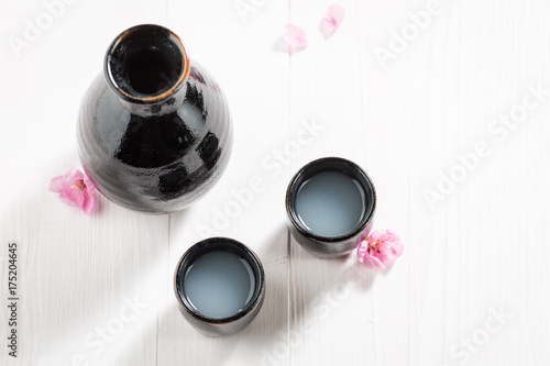Traditional and delicate sake in old black ceramics