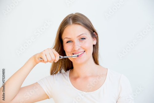 Girl is brushing teeth