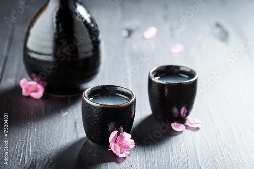 Prepared to drink sake in old black ceramics