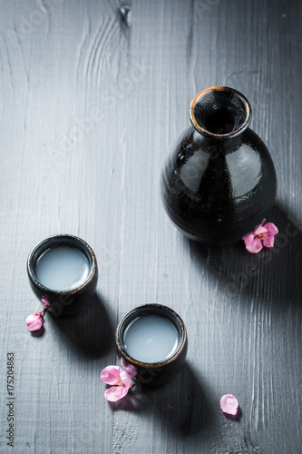 Traditional and delicate sake with flowers of blooming cherry