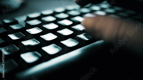 White man hand writing computer keyboard