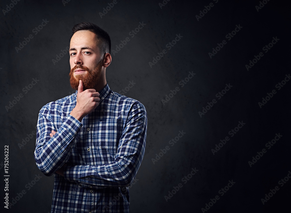 A man with crossed arms, dressed in a blue fleece shirt.