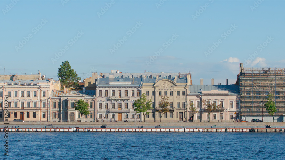 ST PETERSBURG, RUSSIA - JUNE 6, 2017: Outdated houses on the English embankment in the summer