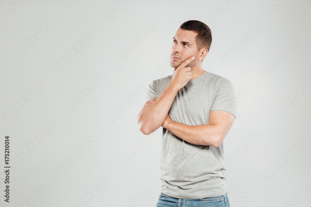 Concentrated thinking young man Concentrated thinking young man