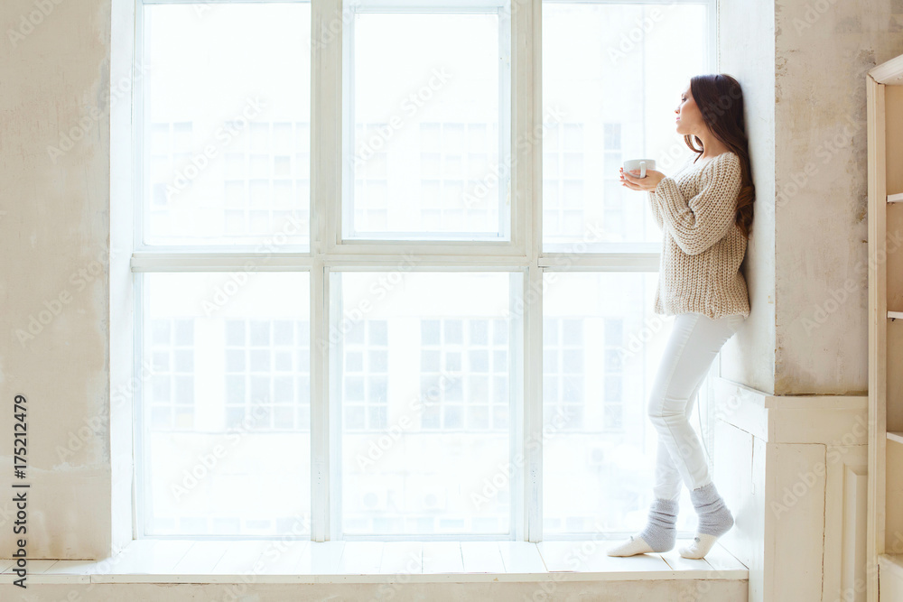 female hands holding hot drinks chocolate winter and christmas concept happy young woman