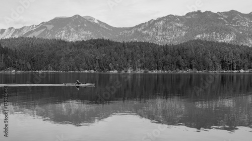 Kanu reflecting in the Eibsee lake in Bavaria 