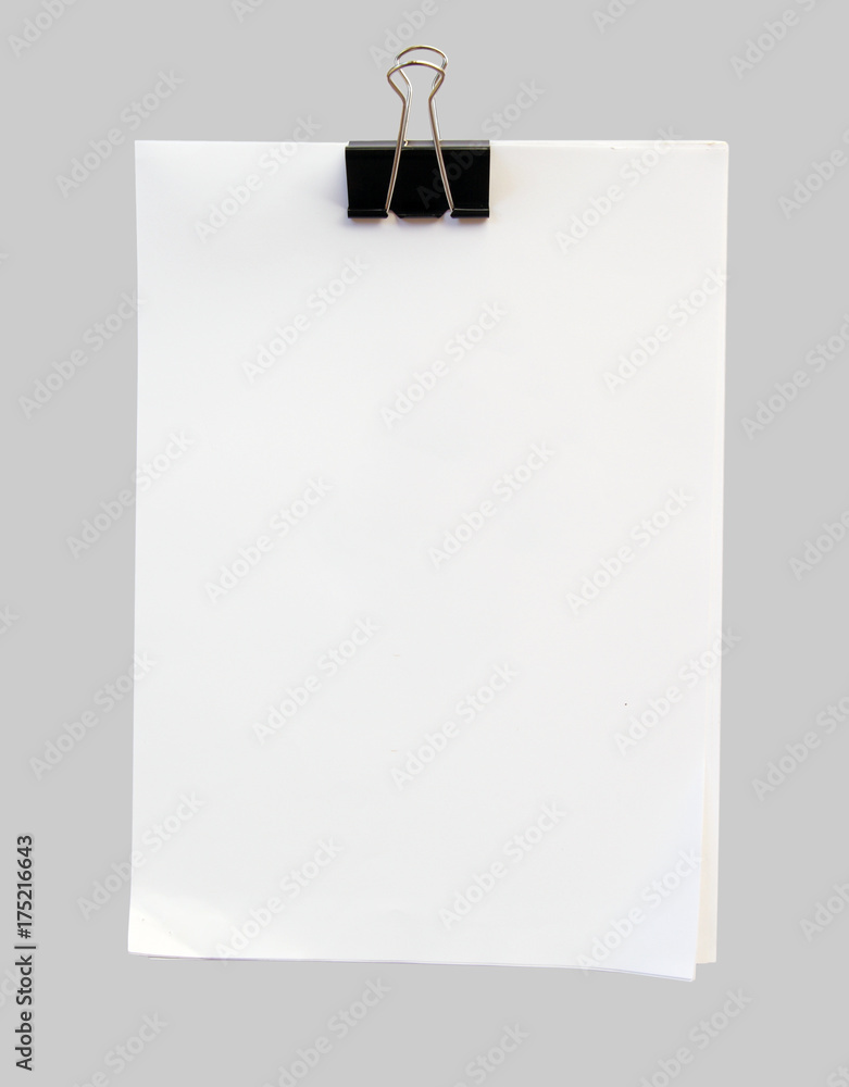 Black clip and White blank note isolate on gray Black clip and White blank note isolate on gray