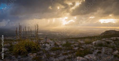 The sun rises over the city on a stormy morning 