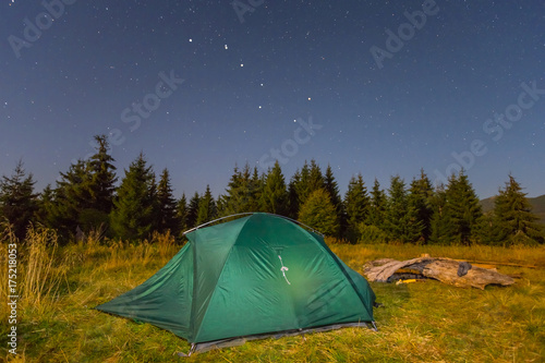 tourisric camp on a forest glade at the night