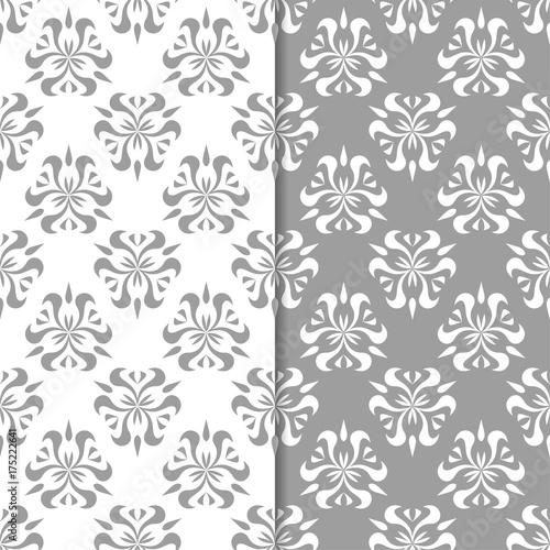 White and gray floral backgrounds. Set of seamless patterns