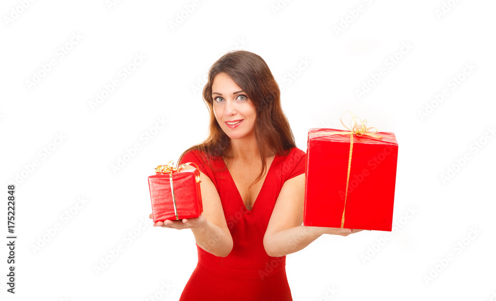 Woman in red dress holding a holiday gift. New year. Christmas Gifts. A young girl smiles and holds a gift in a red box. Happy new year. Birthday gift. Large and small gifts in boxes. Woman in red dress holding a holiday gift. New year. Christmas Gifts. A young girl smiles and holds a gift in a red box. Happy new year. Birthday gift. Large and small gifts in boxes.