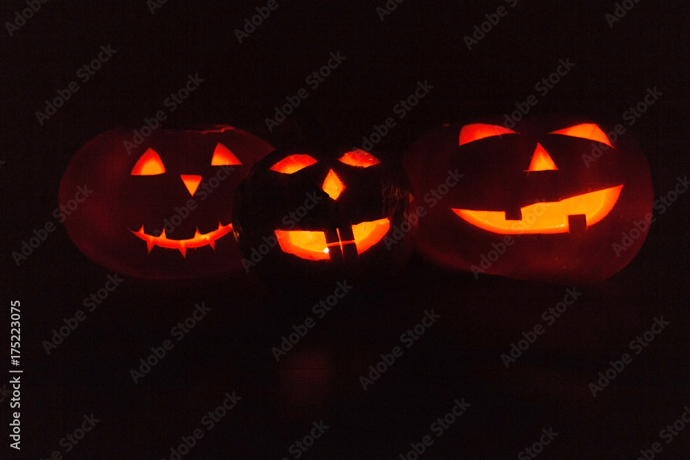 Scary Halloween pumpkins. Scary glowing faces trick or treat. Scary Halloween pumpkins. Scary glowing faces trick or treat.
