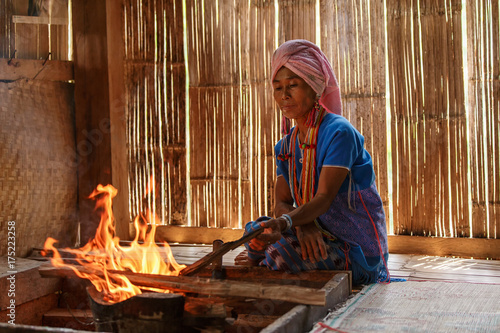 Canvas-taulu Old female karen hill tribe is cooking traditional in the cottage of northern Th