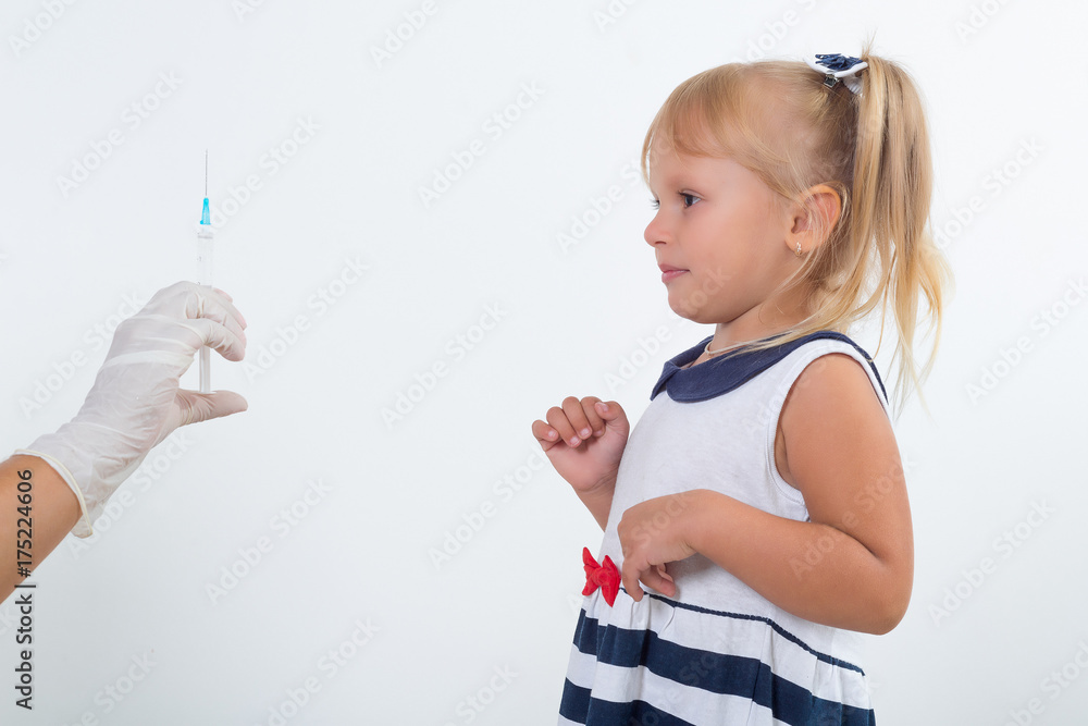 Doctor holds syringe to vaccinate sick baby with injection. Crying and