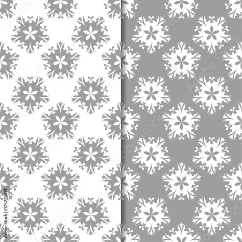 White and gray floral ornaments. Set of seamless backgrounds