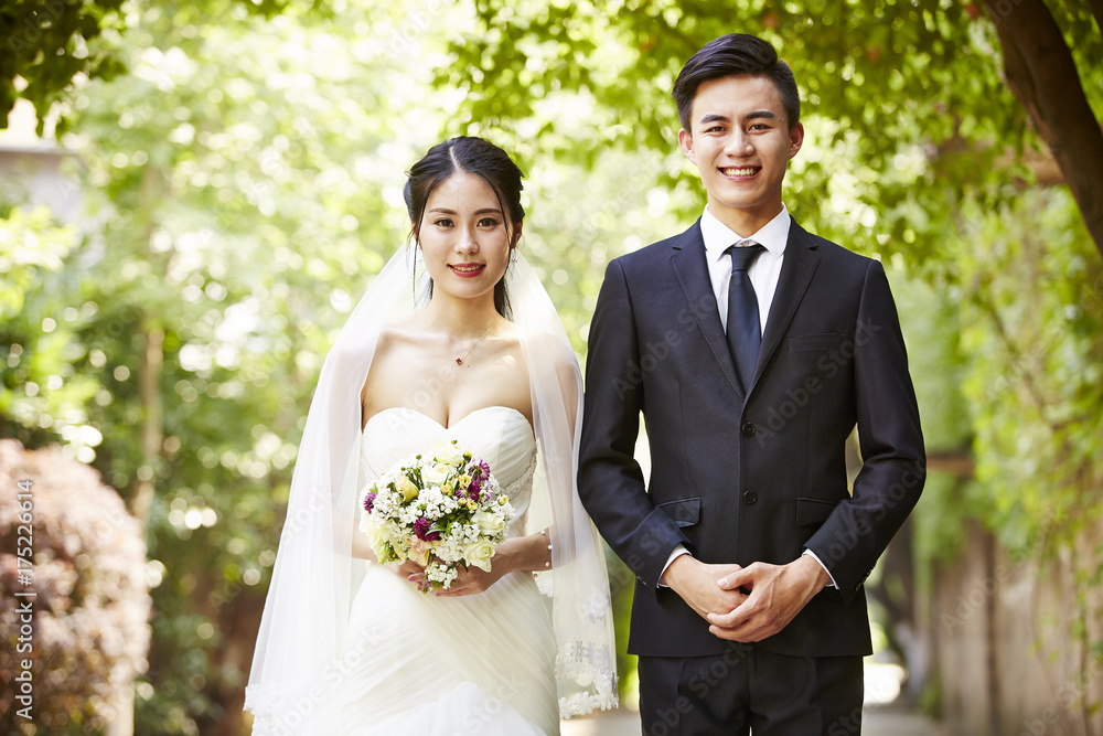 outdoor portrait of a newly-wed asian couple outdoor portrait of a newly-wed asian couple