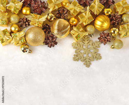 Golden Christmas decorations on a white