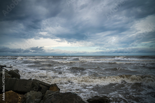 View of storm seascape with dark clouds