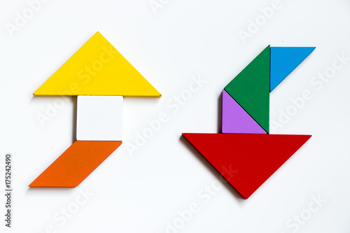 Free Download Color wood tangram puzzle on direction arrow shape in the opposite side on white background - GFXLoad
