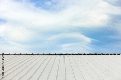 metal corrugated roof sheets against cloudy sky background