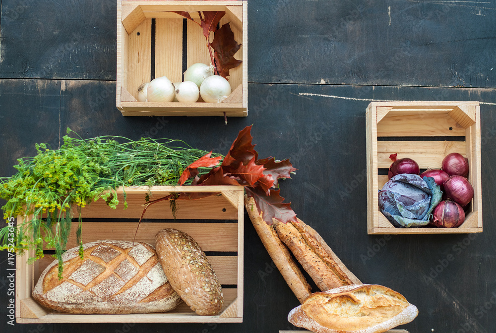 Vegetables and bread in wooden boxes. Autumn composition. Farm Products