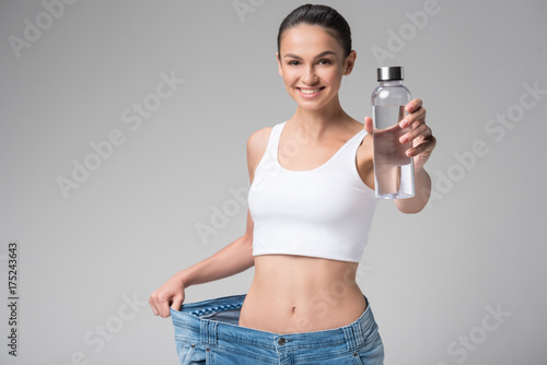 Cheerful fit young woman caring about her health