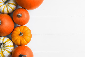 Pumpkins on wooden background