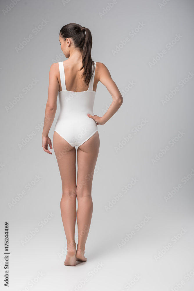 Fototapeta premium Attractive fit young woman posing in swimsuit