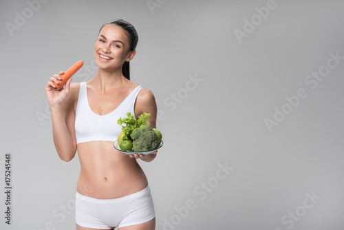 Happy thin young woman enjoying fresh vitamins © Yakobchuk Olena