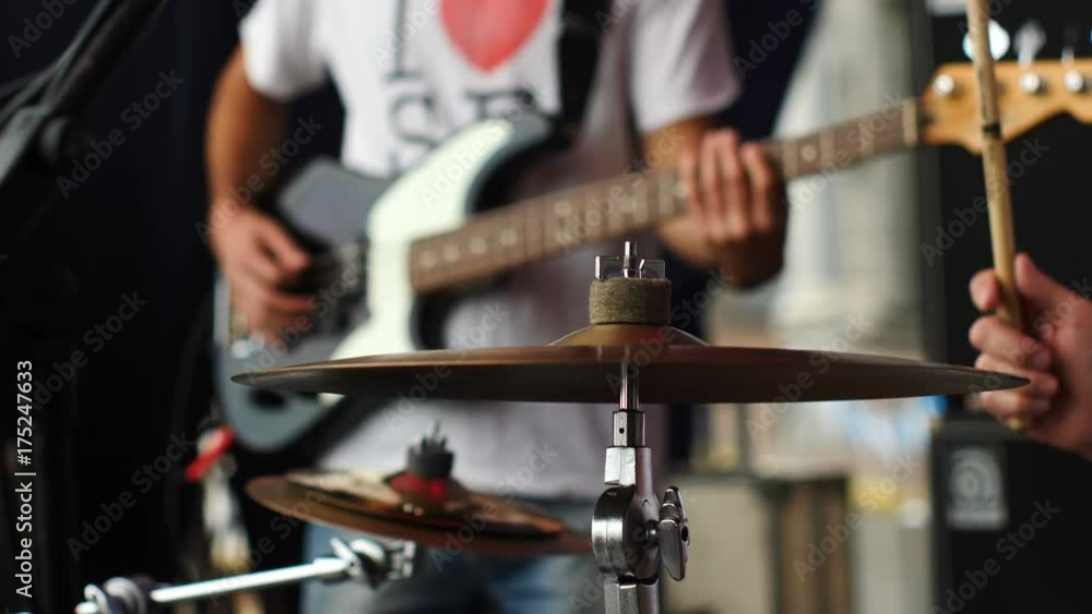 Drummer and Bass guitar player playing on a stage. Drummer and Bass guitar player playing on a stage.