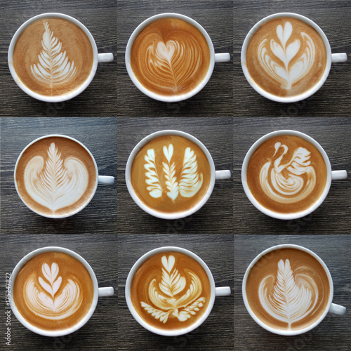 Картината върху платно Collection of top view of  latte art coffee mugs on timber background
