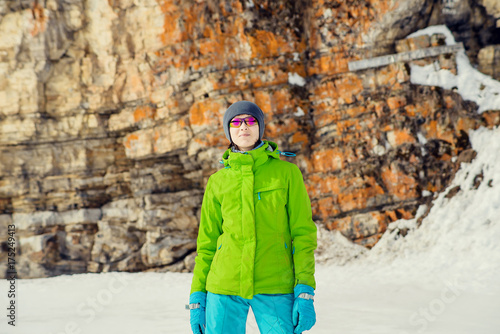 Brave woman trekking in mountains. Risky rock climbing in peaceful wilderness area. High snowy trail © malykalexa777